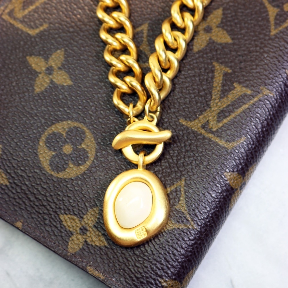 Givenchy Gold Plated Chunky Bracelet with Toggle Clasp and Logo Milk Pendant EUC
